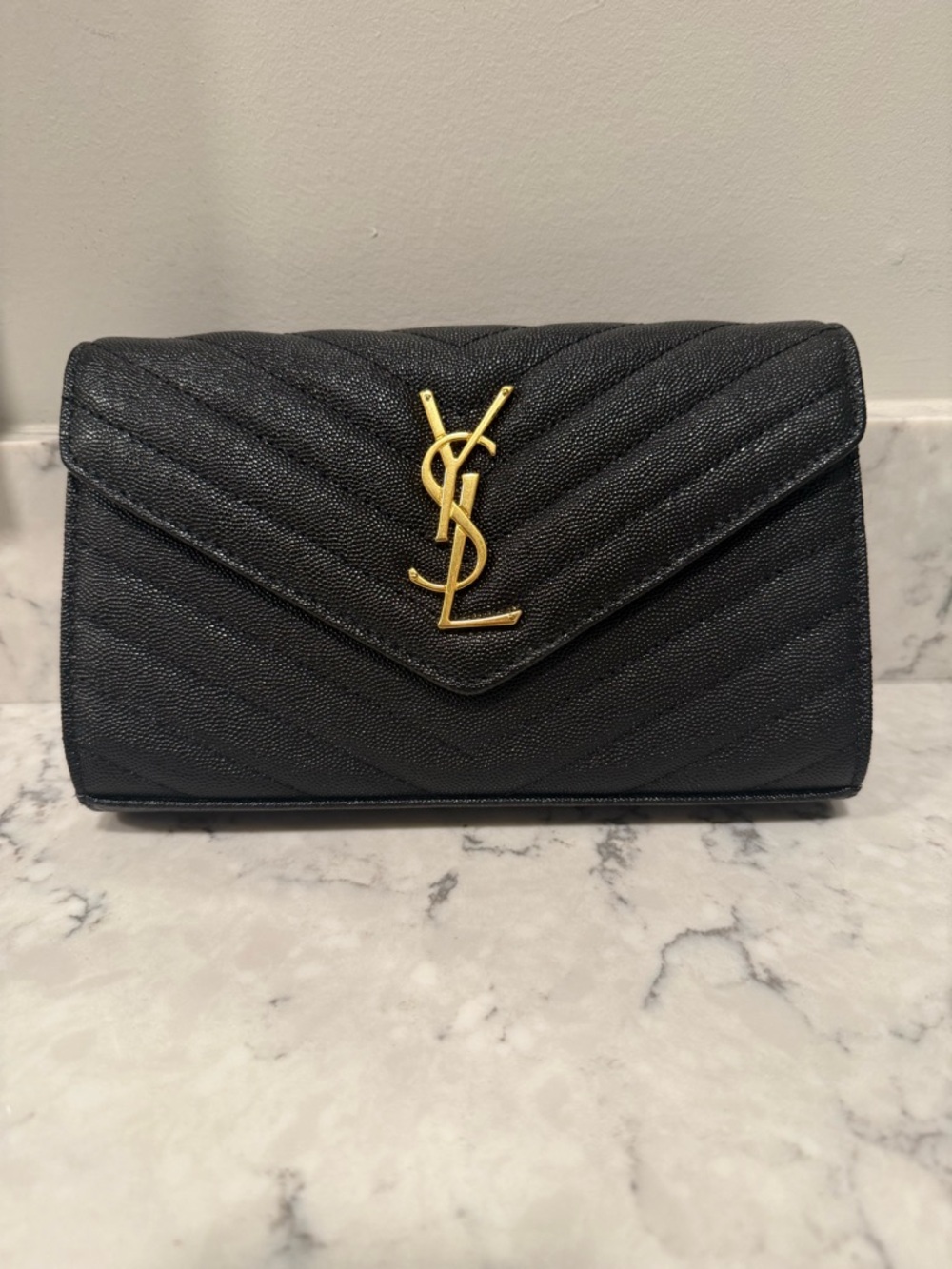 Black quilted envelope clutch, designer-inspired